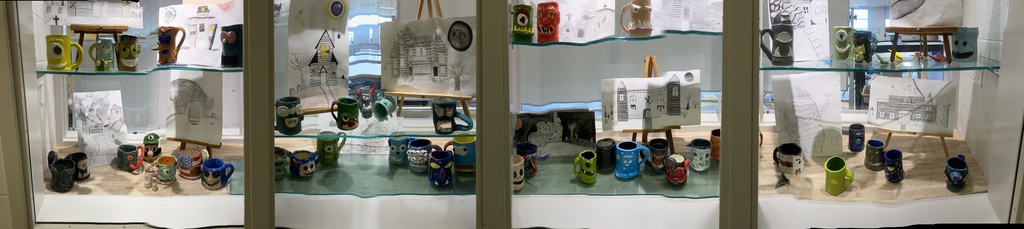 7th and 8th grade creature mugs on display